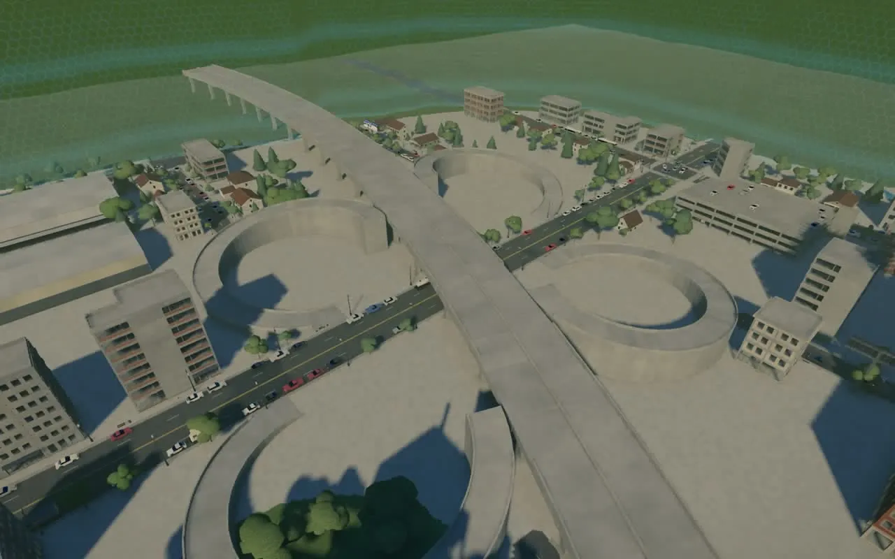 The same crossing before the dressing: bare concrete deck and loops, no lanes or lawns