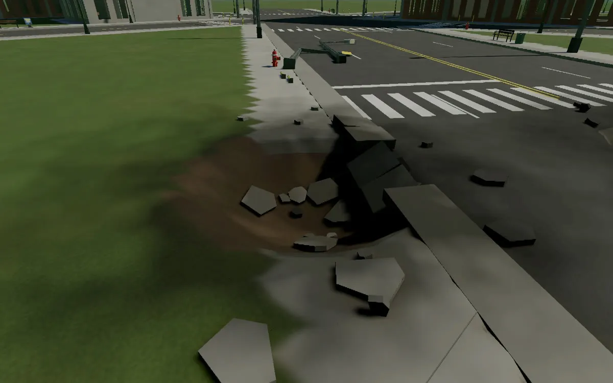 A close view of a crater where a lawn meets the street, with gray slabs of pavement thrown out around its rim