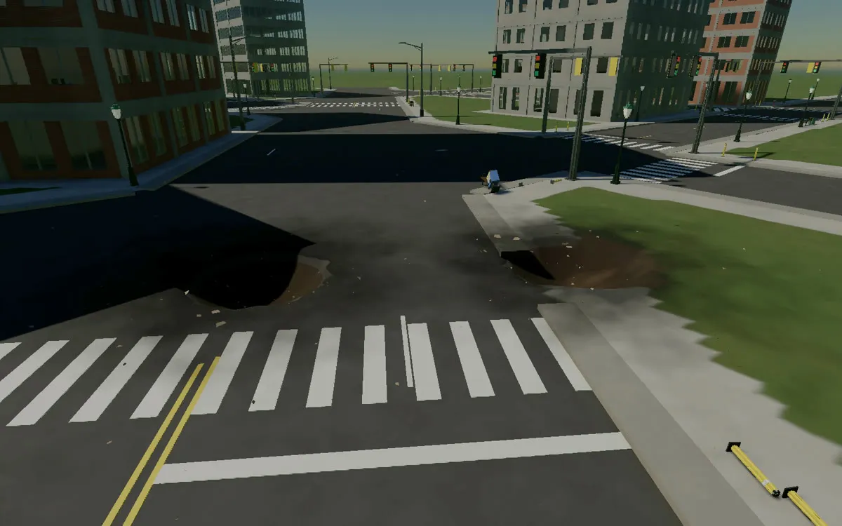 Two craters at a street intersection, with chunks of pavement around them, October 3